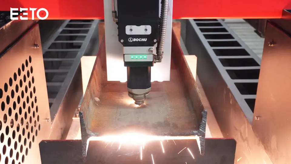 EETO-FGT fiber laser cutting head processing an H-beam metal workpiece