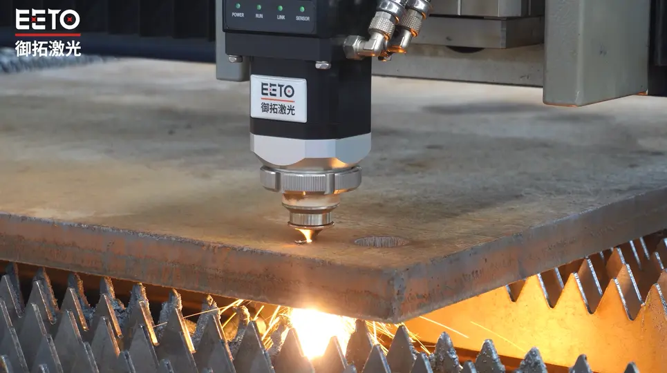 EETO-FGT fiber laser cutting machine cutting a thick metal plate